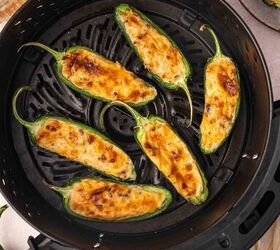 air fryer jalapeno poppers quick easy appetizer, Crispy cooked jalape o poppers with melted cheese centers sitting in air fryer basket ready to serve