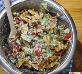 viral crispy pasta salad easy crispy pasta salad recipe, Crispy pasta salad being tossed in a bowl with a silicone spatula
