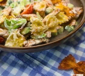 viral crispy pasta salad easy crispy pasta salad recipe, close up image of viral crispy pasta salad in a bowl with blue gingham under it