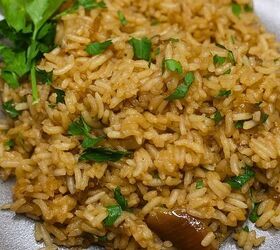 viral stick of butter rice easy baked butter rice recipe, Close up image of stick of butter rice on a plate garnished with parsley