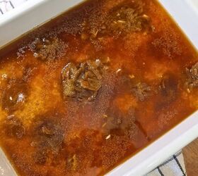 viral stick of butter rice easy baked butter rice recipe, A baking dish with rice soup broth and seasoning in it