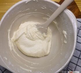 dot cakes easy viral mini dot cake recipe, Buttercream frosting in a mixing bowl with a silicone spatula