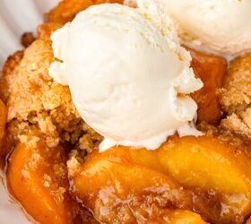 peach cobbler with fresh milled flour, Golden peach cobbler with freshly milled flour with vanilla ice cream on top in a white bowl