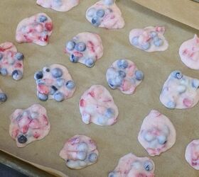 frozen yogurt fruit clusters easy frozen yogurt clusters recipe, Frozen Yogurt fruit clusters on parmchment paper