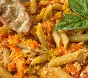 garlic parmesan pasta with chicken, A bowl of baked feta pasta with some crusty bread and basil for decoration