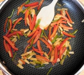 ground beef cheesesteak casserole recipe low carb meal, Overhead image of sliced peppers and onions in a skillet