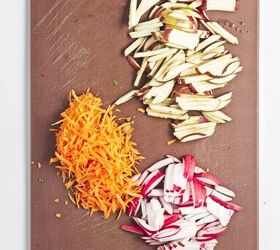 easy kale apple salad with lemon miso dressing, Chopped kale spread on a cutting board ready for kale salad preparation