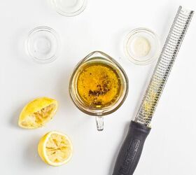 easy kale apple salad with lemon miso dressing, Lemon miso dressing ingredients in a measuring cup with fresh lemon and a microplane zester