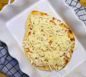 buffalo chicken pizza chicken flatbread pizza recipe, Flatbread in a pan with buffalo sauce shredded chicken and cheese