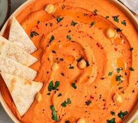 greek yogurt french onion dip with real caramelized onions, A bowl of creamy roasted red bell pepper hummus garnished with chickpeas parsley and paprika surrounded by pita chips and lemon halves on a light surface