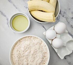 easy banana bread using yellow cake mix recipe, Ingredients for banana bread using yellow cake mix including yellow cake mix ripe bananas eggs and vegetable oil on a marble countertop
