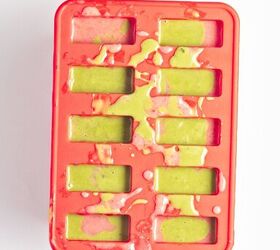 homemade matcha popsicles with strawberry layers, Strawberry and matcha mixtures poured into a popsicle mold to create layered popsicles