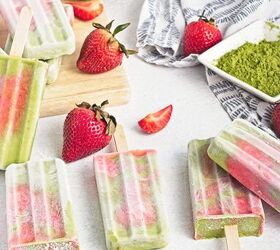 homemade matcha popsicles with strawberry layers, Assorted matcha strawberry popsicles arranged with fresh strawberries and a bowl of matcha powder
