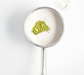 homemade matcha popsicles with strawberry layers, Matcha powder added to the coconut milk mixture in a saucepan