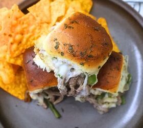 philly cheesesteak sliders easy cheesesteak slider recipe, Three Philly Cheesesteak sliders stacked on top of each other on a plate with chips