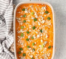 buffalo style chicken dip, Creamy buffalo chicken casserole topped with blue cheese crumbles and green onions ready to serve
