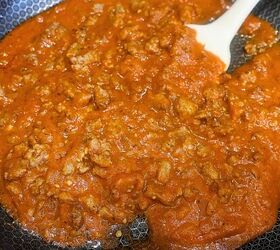 low carb lasagna cups easy keto lasagna cups recipe, Ground sausage cooked with marinara sauce in a skillet with a spatula