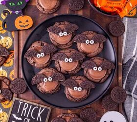 oreo bat cookies made with cake mix and reese s cups, Finished Oreo bat cookies with Reese s peanut butter cups and candy eyes arranged with Halloween decorations