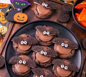 oreo bat cookies made with cake mix and reese s cups, Oreo bat cookies with Reese s peanut butter cups Oreo wings and candy eyes arranged on a black plate with Halloween decorations