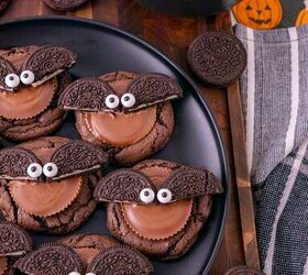 oreo bat cookies made with cake mix and reese s cups, Oreo bat cookies with Reese s peanut butter cups and candy eyes displayed beside Oreos and Halloween treats