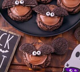 oreo bat cookies made with cake mix and reese s cups, Close up of decorated Oreo bat cookies with chocolate cookies peanut butter cups Oreo wings and candy eyes