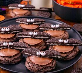 oreo bat cookies made with cake mix and reese s cups, Close up of Oreo bat cookies with peanut butter cup centers Oreo wings and candy eyes on a Halloween display