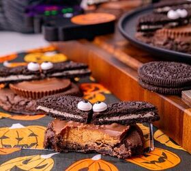oreo bat cookies made with cake mix and reese s cups, Oreo bat cookies topped with Reese s peanut butter cups and candy eyes arranged on a Halloween dessert table