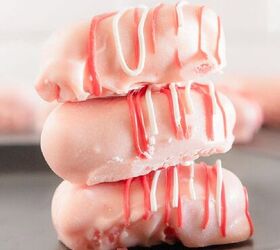 oreo bat cookies made with cake mix and reese s cups, Stack of three pink cake truffles coated in candy melts and drizzled with pink and white chocolate on a black plate