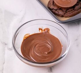oreo bat cookies made with cake mix and reese s cups, Melted chocolate in a bowl for assembling Oreo bat cookies