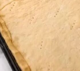 Lay Pillsbury crescent rolls across a cookie sheet for a deliciously unexpected dinner everyone will devour